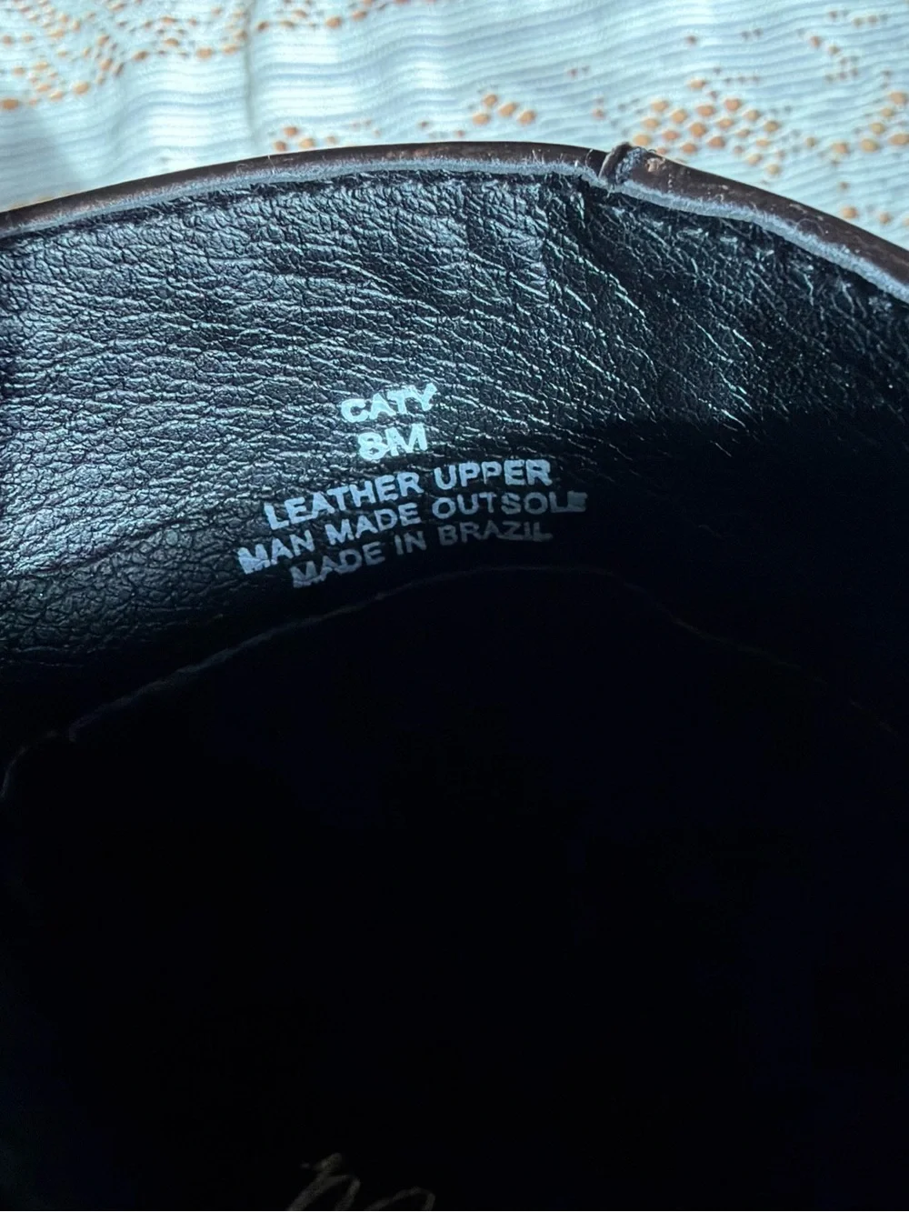 Brown leather boots with a pointed toe